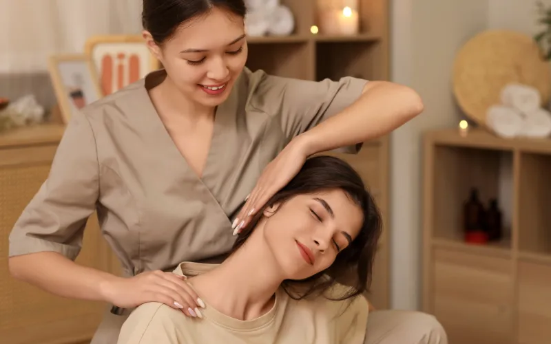 Therapist performing traditional Thai massage stretch techniques in Chennai spa